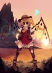  1girl absurdres adapted_costume blonde_hair commentary cowboy_hat fang fang_out flandre_scarlet hair_between_eyes hands_on_own_hips hat highres legs_apart looking_at_viewer outdoors penglai_tea pigeon-toed smile solo standing sunset touhou v-shaped_eyebrows violet_eyes 