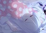  1girl absurdres bed_sheet black_halo blue_archive commentary hair_between_eyes halo highres hina_(blue_archive) long_hair long_sleeves lying matyata on_back pajamas pink_pajamas polka_dot polka_dot_pajamas solo violet_eyes white_hair 