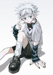 1boy alternate_costume arm_support arm_warmers black_nails black_shoes black_shorts blue_eyes closed_mouth clothes_writing goggles goggles_on_head hashtag-only_commentary headphones headphones_around_neck highres hunter_x_hunter killua_zoldyck knee_up looking_at_viewer male_focus nail_polish okizakana shirt shoes short_hair short_sleeves shorts sitting socks solo spiky_hair striped_arm_warmers t-shirt v white_background white_hair white_shirt white_socks 