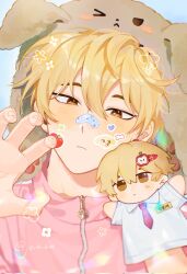  1boy bandage_on_nose blonde_hair blush brown_eyes character_puppet closed_mouth commentary debwi_mos_hamyeon_jugneun_byeong_geollim hair_between_eyes highres jacket joikzo looking_at_viewer male_focus park_moondae pink_jacket single_paw_pose solo sticker sticker_on_face twitter_username untranslatable_commentary zipper_pull_tab 