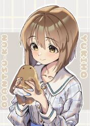  1girl anjerain blush brown_eyes brown_hair character_name checkered_clothes checkered_shirt closed_mouth commentary_request hagiwara_yukiho highres holding idolmaster idolmaster_(classic) long_hair shirt short_hair smile solo upper_body white_shirt 