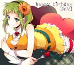  flower food fork fruit green_eyes green_hair gumi hair_flower hair_ornament happy_birthday heart holding lying on_stomach pillow ponjiritsu rittu short_hair skirt smile solo strawberry vocaloid wrist_cuffs 