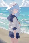  1girl beach blue_eyes blue_hair blue_sailor_collar blue_skirt clouds day flat_cap hair_between_eyes hammer_and_sickle hat hibiki_(kancolle) highres kantai_collection long_hair looking_at_viewer mei_namene neckerchief ocean outdoors pleated_skirt red_neckerchief sailor_collar school_uniform serafuku skirt sky solo verniy_(kancolle) water white_headwear 