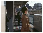  1girl black_hair border coat dappled_sunlight hair_behind_ear hands_in_pockets highres k_(kamo_kamen) kamo_kamen original photo_background real_world_location short_hair sign solo_focus standing sunlight train train_station train_station_platform upper_body white_border 