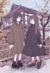  2girls absurdres black_footwear black_hair black_socks blunt_bangs blush brown_hair building closed_mouth coat day dress fence full_body highres long_hair long_sleeves looking_at_viewer multiple_girls orange_socks original outdoors shoes short_hair sky sneakers socks standing sweater sweater_under_dress tree yunoki_itsugu 