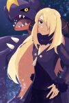  1girl blonde_hair closed_mouth coat commentary_request cynthia_(pokemon) eyelashes fur-trimmed_coat fur_collar fur_trim garchomp garuta01_(daigosan00001) hair_ornament hair_over_one_eye hand_on_own_hip highres long_hair long_sleeves looking_at_viewer pants pokemon pokemon_(creature) pokemon_(game) pokemon_dppt shirt smile 