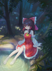  1girl absurdres ascot barefoot bow brown_eyes brown_hair chinese_commentary commentary_request detached_sleeves forest frilled_bow frilled_hair_tubes frilled_skirt frills hair_bow hair_tubes hakurei_reimu highres long_hair looking_at_viewer nature outdoors red_bow red_skirt ribbon-trimmed_skirt ribbon-trimmed_sleeves ribbon_trim ripples sitting skirt skirt_set soaking_feet solo toes toorooo touhou tree water yellow_ascot 