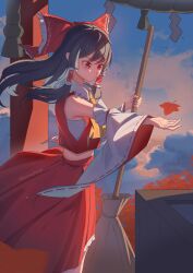  1girl ascot autumn_leaves bow box broom brown_hair chest_sarashi chinese_commentary commentary_request detached_sleeves donation_box falling_leaves frilled_bow frilled_hair_tubes frills hair_bow hair_tubes hakurei_reimu highres holding holding_broom hua_cai_hanana leaf long_hair maple_leaf red_bow red_eyes red_skirt ribbon-trimmed_sleeves ribbon_trim sarashi skirt skirt_set solo torii touhou yellow_ascot 