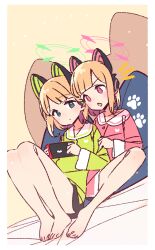  2girls animal_ear_headphones animal_ears bare_legs barefoot black_shorts blonde_hair blue_archive blunt_bangs blush border cat_ear_headphones cat_ears closed_mouth commentary_request dot_nose fake_animal_ears full_body green_eyes green_halo green_shirt halo headphones highres jaggy_lines knees_up long_sleeves midori_(blue_archive) momoi_(blue_archive) multiple_girls notice_lines on_bed open_mouth pink_halo pink_shirt red_eyes shirt short_hair short_shorts shorts siblings sidelocks sisters sitting twins v-shaped_eyebrows white_border yoru_nai 