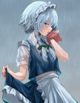  1girl apron blue_eyes blush braided_sidelock frilled_hairband frills grey_hair hair_ribbon hairband highres izayoi_sakuya looking_at_viewer maid_apron mikan_(manmarumikan) outdoors profile rain ribbon sideways_glance skirt_hold solo touhou water_drop wet wet_clothes wet_hair 