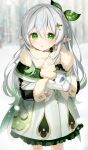  1girl :o absurdres alternate_hairstyle blurry blurry_background blush braid cape commentary cross-shaped_pupils crown_braid dress frilled_dress frills fur-trimmed_sleeves fur_scarf fur_trim genshin_impact gold_trim gradient_hair green_cape green_eyes green_hair hair_between_eyes hair_ornament hairclip highres holding_snowman leaf_hair_ornament long_hair long_sleeves looking_at_viewer memeno mittens multicolored_hair nahida_(genshin_impact) outdoors pointy_ears raised_eyebrows snowing solo standing streaked_hair symbol-shaped_pupils twitter_username white_dress white_hair white_mittens winter 
