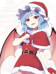  1girl asutora bat_wings belt black_belt blue_hair blush capelet cowboy_shot dress fang gloves hat highres open_mouth pointy_ears pom_pom_(clothes) red_capelet red_eyes red_headwear remilia_scarlet santa_costume santa_dress santa_gloves santa_hat short_hair smile solo touhou wings 