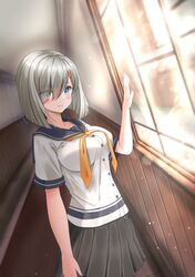  1girl blue_eyes breasts dutch_angle eyes_visible_through_hair grey_hair grey_sailor_collar grey_skirt hair_ornament hair_over_one_eye hairclip hallway hamakaze_(kancolle) highres kantai_collection large_breasts light_smile nazono_neko neckerchief pleated_skirt sailor_collar school_uniform serafuku short_hair skirt solo window yellow_neckerchief 