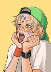  1boy backwards_hat baseball_cap blonde_hair chainsaw_man commentary_request denji_(chainsaw_man) hat head_rest heureoreo korean_commentary male_focus orange_eyes sharp_teeth shirt smartwatch solo sticker_on_face t-shirt teeth tongue tongue_out upper_body watch watch wristband yellow_background 