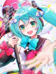  1girl ahoge blue_eyes blue_hair blurry blurry_foreground blush bow bowtie detached_sleeves dress hair_ornament hair_ribbon hatsune_miku headphones highres holding holding_wand long_hair long_sleeves looking_at_viewer magical_mirai_(vocaloid) magical_mirai_miku magical_mirai_miku_(2018) megaphone open_mouth reaching reaching_towards_viewer ribbon sleeve_bow sleeveless sleeveless_dress smile solo twintails uzuki_sena very_long_hair vocaloid wand 