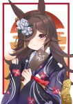  1girl animal_ears black_kimono brown_hair floral_print flower furisode hair_flower hair_ornament hair_over_one_eye highres holding holding_paddle horse_ears horse_girl japanese_clothes kimono long_hair looking_at_viewer new_year paddle rice_shower_(umamusume) setu_(shining12) smile solo umamusume violet_eyes white_flower wide_sleeves 