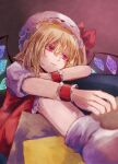 1girl blonde_hair couch crystal dress flandre_scarlet hat highres medium_hair on_couch pillow red_dress red_eyes red_ribbon ribbon sitting solo touhou tunaneko 