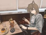  1girl absurdres animal_ears black_pants brown_hair cafe cat_ears chair cup double-parted_bangs drinking_glass food grey_eyes hair_between_eyes highres indoors looking_at_viewer original pants plate pudding restaurant scenery shirt sitting spoon t-shirt table v watch watch white_shirt zumochi 