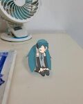 blue_hair book closed_eyes fan hatsune_miku sleeping sleeping_while_sitting stagking