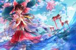 1girl ascot bow brown_hair clouds commentary_request day detached_sleeves flower frilled_bow frilled_hair_tubes frills hair_bow hair_tubes hakurei_reimu holding holding_flower lily_pad long_hair looking_at_viewer multiple_torii own_hands_together red_bow red_skirt skirt skirt_set solo tg torii touhou water water_lily_flower yellow_ascot yellow_eyes 