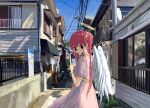  1girl alley angel_wings black_eyes blue_sky bracelet dress earrings enoshima fence gold_earrings halo highres holding holding_paper house jewelry kibishiihiekomi looking_at_viewer looking_back original paper pink_dress pink_hair power_lines sky solo standing twintails window wings 