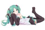  1girl aqua_eyes aqua_hair aqua_nails aqua_necktie aqua_trim bare_shoulders black_sleeves black_thighhighs feet feet_up full_body grey_shirt hatsune_miku highres legs_up looking_at_viewer lying necktie no_shoes on_stomach parted_bangs shirt shoulder_tattoo sleeves_past_wrists soles solo tattoo the_pose thigh-highs twintails vocaloid yakkl 