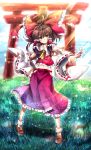  bow brown_hair detached_sleeves grass hair_bow hair_tubes hakurei_reimu japanese_clothes looking_at_viewer midriff salay skirt skirt_set smile socks solo sunbeam sunlight torii touhou wide_sleeves yellow_eyes 