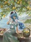  1girl absurdres alternate_costume arm_support basket bird blue_hair breasts casual city day food fruit ganyu_(genshin_impact) genshin_impact goat_horns grey_skirt hair_between_eyes hand_up highres horns lankie lemon long_hair long_skirt looking_to_the_side medium_breasts mountainous_horizon ocean on_railing outdoors parted_lips puffy_short_sleeves puffy_sleeves railing shirt short_sleeves sidelocks sitting skirt solo tree tree_shade white_shirt wind 