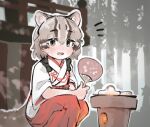  1girl alternate_costume animal_ears blush brown_hair cat_ears cat_girl cat_tail extra_ears green_eyes grey_hair hair_between_eyes hakama japanese_clothes kemono_friends kosode looking_at_viewer miko multicolored_hair print_paper_fan red_hakama shirt short_hair short_sleeves sidelocks smile solo squatting tail toki_reatle tsushima_leopard_cat_(kemono_friends) white_shirt 