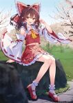  1girl bare_shoulders blush bow brown_hair day detached_sleeves frilled_skirt frills full_body hair_bow hair_tubes hakurei_reimu highres japanese_clothes long_hair murasaki_atsushi navel nontraditional_miko open_mouth outdoors red_bow red_footwear red_skirt ribbon-trimmed_sleeves ribbon_trim shoes sidelocks sitting skirt smile socks solo touhou twitter_username white_sleeves white_socks wide_sleeves yellow_eyes 