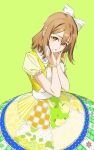 1girl :o absurdres bow bracelet brown_hair commentary dress green_background hair_between_eyes hair_bow hands_on_own_cheeks hands_on_own_face head_tilt highres jewelry koiori kunikida_hanamaru looking_at_viewer love_live! love_live!_sunshine!! medium_hair parted_lips puffy_short_sleeves puffy_sleeves short_sleeves sidelocks solo symbol-only_commentary upper_body white_bow yellow_dress yellow_eyes 
