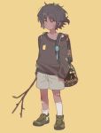  1boy aged_down arknights arouni22 backpack bag bandaid bandaid_on_leg black_hair black_sweater brown_footwear choshanland_plushy_(arknights) dark-skinned_male dark_skin dirty full_body grey_shorts holding holding_stick keychain leaf leaf_on_head looking_at_viewer male_focus shoes short_hair shorts simple_background sneakers socks solo stick sweater thorns_(arknights) undershirt white_socks yellow_background yellow_eyes 