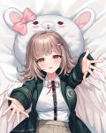 1girl 71150521_(user_agrk2888) :d angel_wings bed_sheet black_jacket black_shirt blush bow breasts brown_hair commentary_request danganronpa_(series) danganronpa_2:_goodbye_despair feathered_wings galaga hair_ornament highres jacket large_breasts medium_hair nanami_chiaki open_clothes open_jacket outstretched_arms pink_bow pink_eyes shirt shirt_tucked_in smile solo two-tone_shirt usami_(danganronpa) white_shirt wings 
