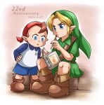  2boys anniversary aogaeru_(pixiv46613656) bandana blonde_hair blue_eyes blue_shorts boots brown_footwear brown_hair dated green_skirt green_tunic highres holding holding_notebook jim_(zelda) leather leather_boots link long_sleeves multiple_boys notebook phrygian_cap pointy_ears red_bandana shorts skirt the_legend_of_zelda the_legend_of_zelda:_majora&#039;s_mask young_link 