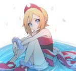  1girl anklet bare_shoulders blonde_hair blue_eyes bracelet cherry_blossoms closed_mouth falling_petals frown hairband highres irida_(pokemon) jewelry looking_up neck_ring noi_(noi_pk27) petals pokemon pokemon_legends:_arceus red_footwear red_hairband shoes short_hair shorts sitting solo water white_shorts 