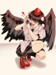  1girl ;d belt bird_wings black_belt black_hair black_ribbon black_skirt black_socks black_wings buttons camera collared_shirt commentary_request feathered_wings full_body geta hat highres holding holding_camera kneehighs kneeling miniskirt one_eye_closed open_mouth pleated_skirt pom_pom_(clothes) puffy_short_sleeves puffy_sleeves red_eyes red_footwear red_hat ribbon shameimaru_aya shirt short_hair short_sleeves simple_background skirt smile socks solo teeth tengu-geta tokin_hat touhou turtle-kun upper_teeth_only white_background white_shirt wings 