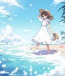  1girl arisa_(aren) artist_name barefoot beach bird blue_sky brown_hair clouds cloudy_sky day dolphin dress flower frilled_sleeves frills hand_on_headwear hat hat_flower highres holding holding_clothes holding_footwear medium_hair ocean original outdoors palm_tree red_flower seagull shell short_sleeves signature sky solo starfish tidal_wave tree water white_dress yellow_hat 