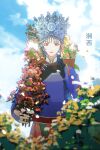  1girl absurdres blue_sky blurry book braid chinese_clothes chinese_text clouds crown day flower highres hmong holding long_hair long_sleeves looking_at_viewer miao_clothes miao_hat original outdoors plant qiushiri red_eyes sky smile solo 