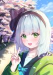  1girl alternate_costume black_hairband blue_sky blush cherry_blossoms clothing_request clouds commentary day falling_petals green_eyes hairband highres konpaku_youmu medium_hair narutakaya open_mouth outdoors petals pink_petals sky smile solo touhou tree v white_hair 