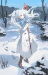  1girl bare_tree boots closed_mouth coat day frieren full_body fur_trim hashtag-only_commentary highres holding jacket long_hair long_sleeves mage_staff mountain nature scarf sky snow snowcake47 snowflakes snowing solo sousou_no_frieren standing tree twintails very_long_hair white_coat white_hair winter winter_clothes winter_coat 