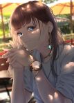  1girl aqua_nails bad_id bad_pixiv_id blue_eyes blurry blurry_background brown_hair dangle_earrings earrings highres jewelry long_hair looking_at_viewer nail_polish original own_hands_together photo_background saitou_(lynx-shrike) shirt smile solo t-shirt watch watch white_shirt 