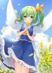  1girl blue_skirt blue_vest blush closed_mouth clouds cloudy_sky collared_shirt cowboy_shot daiyousei day fairy fairy_wings flower green_eyes green_hair highres holding holding_flower long_hair looking_at_viewer outdoors petticoat puffy_short_sleeves puffy_sleeves ruhika shirt short_sleeves side_ponytail skirt sky smile solo touhou vest white_shirt wings yellow_flower 