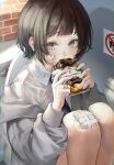  1girl absurdres black_hair blue_eyes blue_necktie crying crying_with_eyes_open dalla_(888_dalae) doughnut eating food gauze_on_cheek gauze_on_knee highres jacket knees_up looking_at_viewer necktie on_toilet original shirt sitting solo tears white_jacket white_shirt 