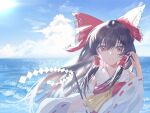  1girl absurdres ascot blue_sky bow brown_eyes brown_hair chinese_commentary clouds commentary_request day detached_sleeves frilled_bow frilled_hair_tubes frills gohei hair_bow hair_tubes hakurei_reimu highres holding holding_gohei long_hair ocean red_bow ribbon-trimmed_sleeves ribbon_trim sky solo touhou trrzh yellow_ascot 