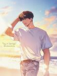  1boy beach belt blue_pants brown_eyes brown_hair clouds cowboy_shot denim english_text gradient_sky hand_in_own_hair highres horizon jeans jeong_taeui light_blush male_focus mistletoebirdy ocean official_style one_eye_closed open_mouth pants passion_(manhwa) shirt short_sleeves sky smile solo white_shirt 