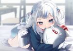  1girl animal_costume animal_hood biting bloop_(gawr_gura) blue_eyes blue_hair blue_hoodie blunt_bangs blurry blurry_background chair desk fang fins fish_tail gawr_gura gawr_gura_(1st_costume) grey_hair hair_ornament hololive hololive_english hood hoodie long_sleeves looking_at_viewer lying multicolored_hair on_bed on_stomach paraffin shark_costume shark_girl shark_hair_ornament shark_hood shark_print shark_tail sharp_teeth shoes solo streaked_hair tail teeth two_side_up virtual_youtuber 