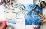  1girl abstract aqua_hair art_tools_in_frame blue_eyes collage commentary_request dress floating_hair flower foreshortening from_behind green_hair hair_ornament hand_up hatsune_miku highres honno_sukoshi_no_sayonara_(vocaloid) long_hair looking_at_viewer looking_back low_twintails masking_tape masking_tape_(medium) multicolored_hair newsprint_texture open_mouth overhead_line photo_(medium) ryono short_sleeves signature solo traditional_media twintails upper_body vocaloid white_dress worried 