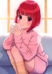  1girl absurdres arima_kana bob_cut closed_mouth couch cup highres holding holding_cup indoors konatsu_miki light_blush light_smile looking_at_viewer on_couch oshi_no_ko pants pink_pants pink_shirt red_eyes redhead shirt short_hair socks solo window 