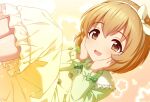  1girl blush bow bow_hairband brown_eyes brown_hair commentary dress floral_background frilled_dress frilled_sleeves frills fuu_(koneko_no_yomeiri) gradient_background green_bow green_dress hairband hands_on_own_chin idolmaster idolmaster_cinderella_girls koga_koharu legs_up lens_flare long_sleeves lying open_mouth pink_background short_hair smile solo white_hairband yellow_background 
