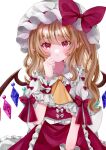  1girl adapted_costume ascot blonde_hair blush bow clenched_hand commentary cowboy_shot crystal eyelashes eyes_visible_through_hair flandre_scarlet frilled_shirt_collar frilled_skirt frilled_wrist_cuffs frills hair_between_eyes hand_up hat hat_bow heart heart-shaped_pupils highres huge_bow jaku_sono long_hair looking_at_viewer mob_cap parted_lips pointy_ears puffy_short_sleeves puffy_sleeves red_bow red_eyes red_skirt red_vest red_wrist_cuffs shirt shirt_bow short_sleeves sidelocks signature simple_background skirt sleeve_bow solo straight-on symbol-shaped_pupils touhou tsurime vest wavy_hair white_background white_bow white_hat white_shirt wings wrist_cuffs yellow_ascot 